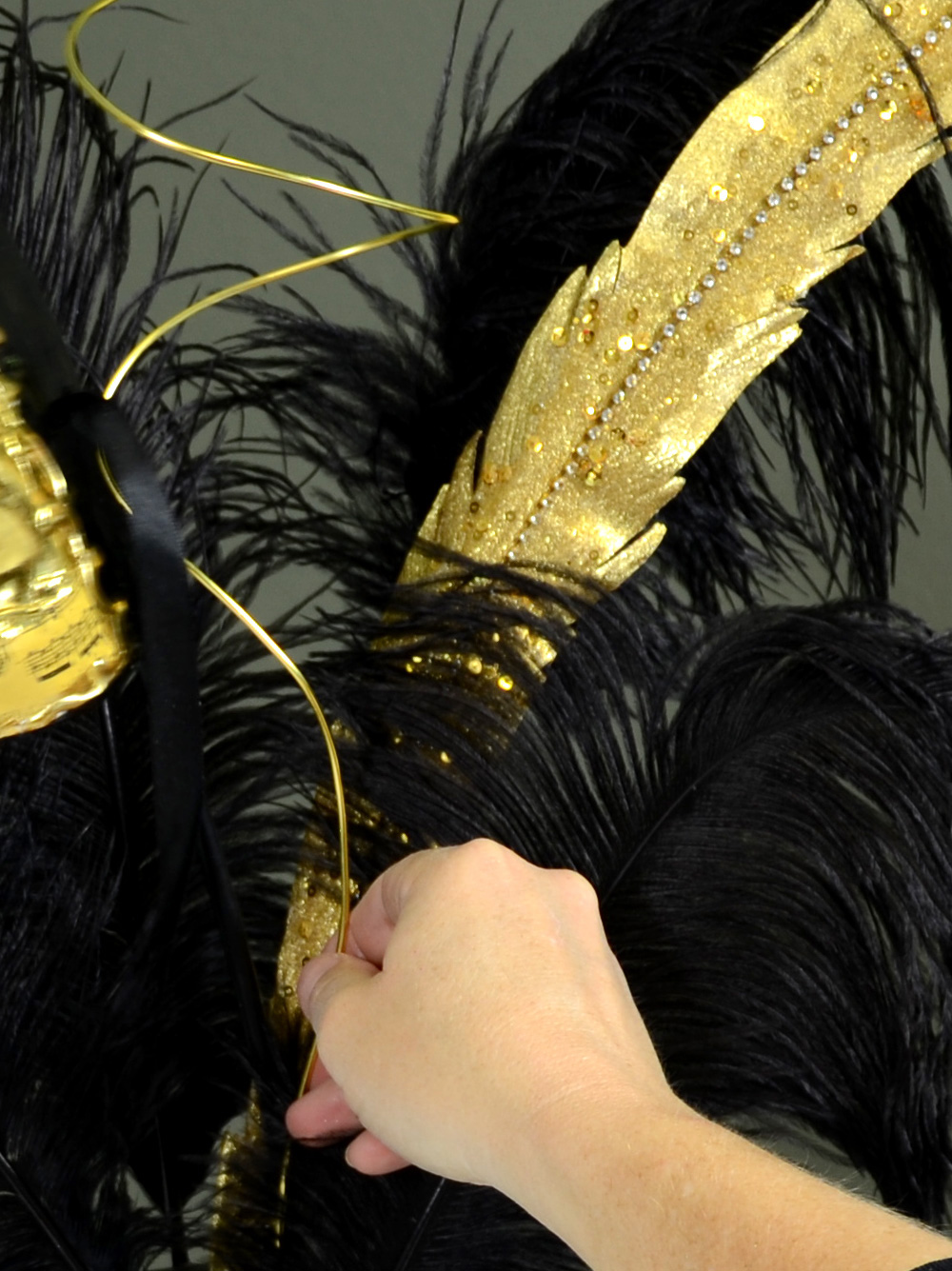 Insert gold wire curls into Mask Centerpiece