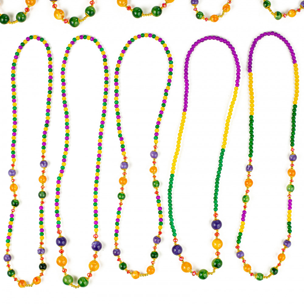 Full frame background of Mardi Gras feather boa and beads Stock